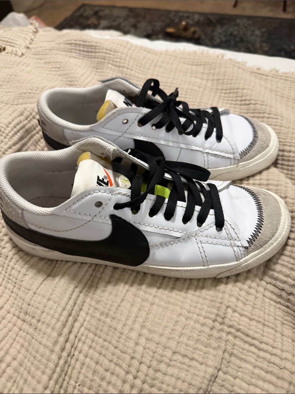 Nike Women’s White Low-Top Sneakers with Black Swoosh